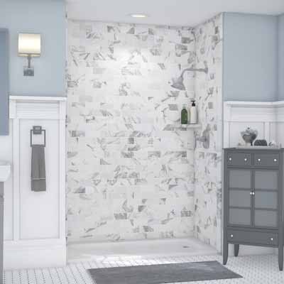 Blue walled bathroom with splotch style tiled shower